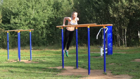 girl training on parallel bars