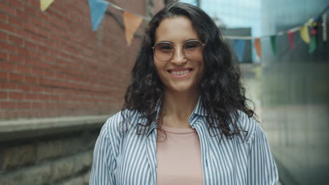 smiling woman in an urban alley