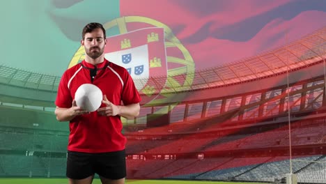 professional rugby player standing in front of a flag and stadium