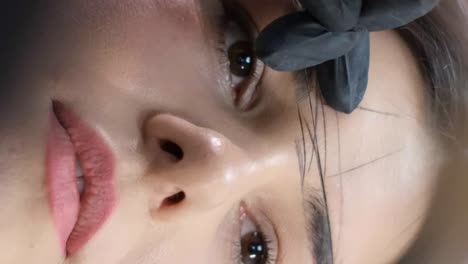 close-up of an eyebrow microblading procedure