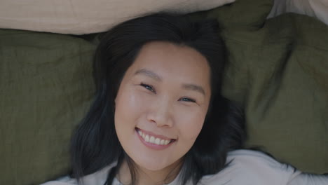 happy woman lying in bed