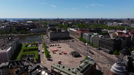 Drone-orbits-above-park-square-near-waterfront-in-Helsinki-Finland