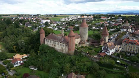 pull back establishing drone shot of chenaux castle in estavayer-le-lac in canton of fribourg switzerland