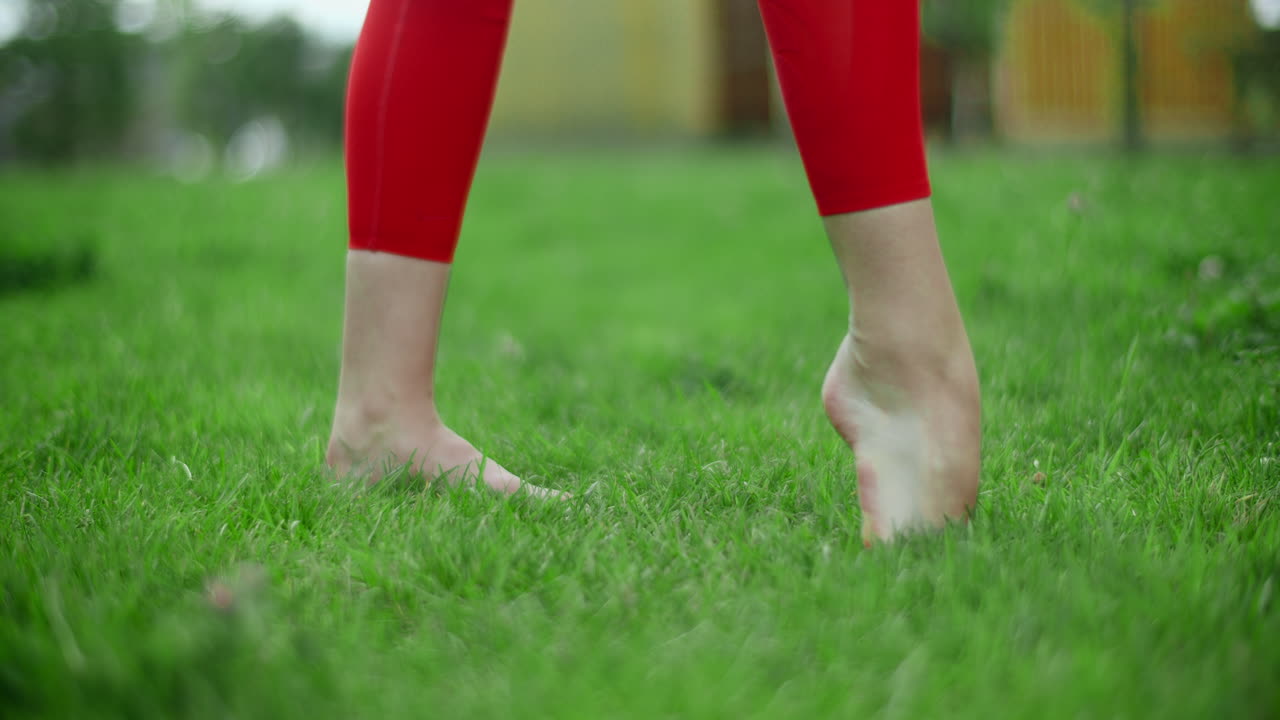 Woman doing a balancing exercise outdoors