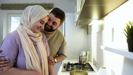 side view of woman with hiyab in the kitchen.