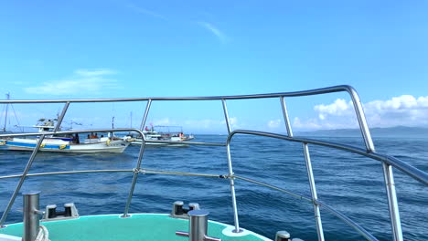 ship shakes at high waves in front of a batch of ships