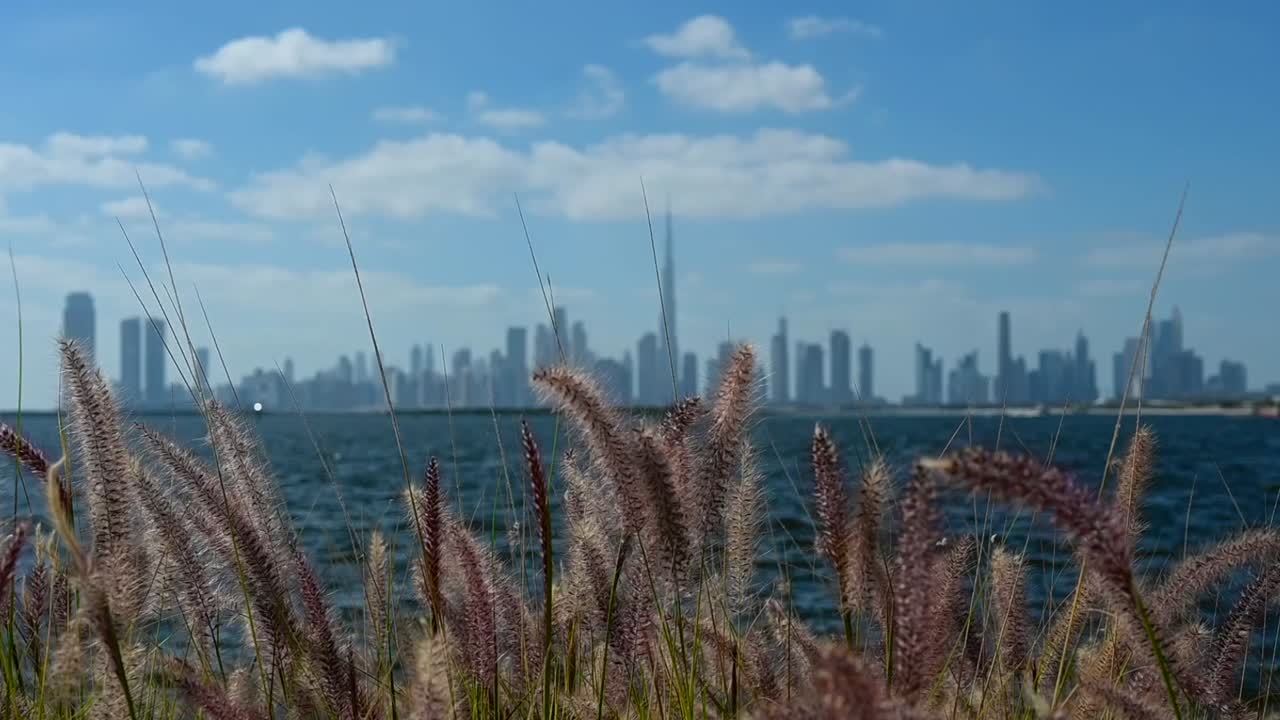 Dubai city skyline from the creek harbour on a beautiful bright sunny day in the United Arab Emirates.