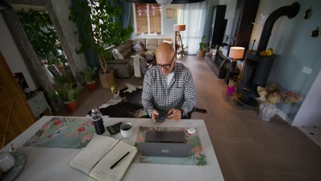 man working from home in a modern living room