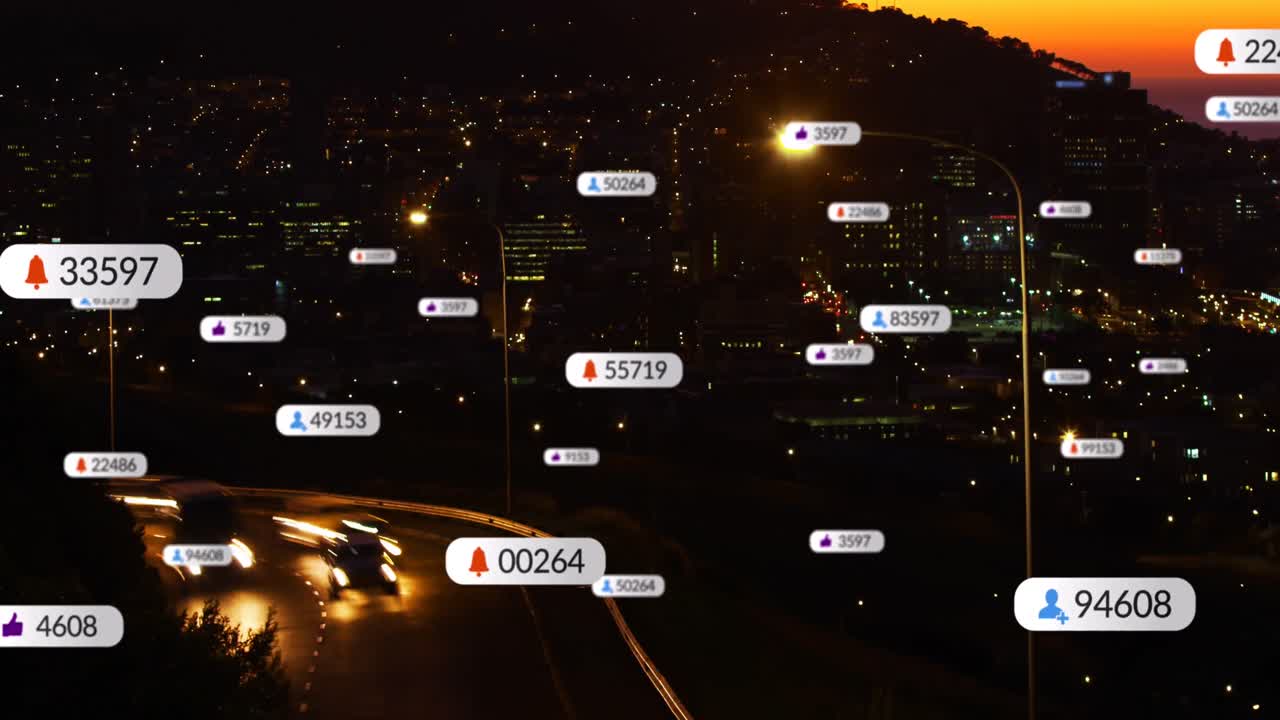 Animation of social media icons floating against time-lapse of aerial view of night cityscape