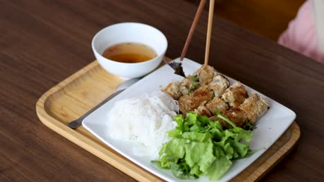 person enjoying a vietnamese noodle meal