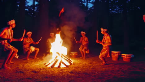 tribal dance around a campfire at night