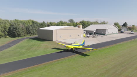 Crop-Duster-Plane-Taking-Off-on-Runway-in-Rural-Farm-Field