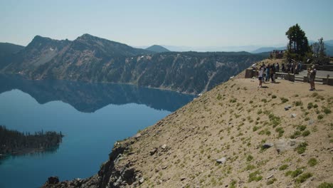 Panning-across-a-mountainous-lake-with-an-island-in-the-middle