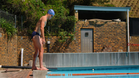 male swimmer getting ready for jump in swimming pool 4k