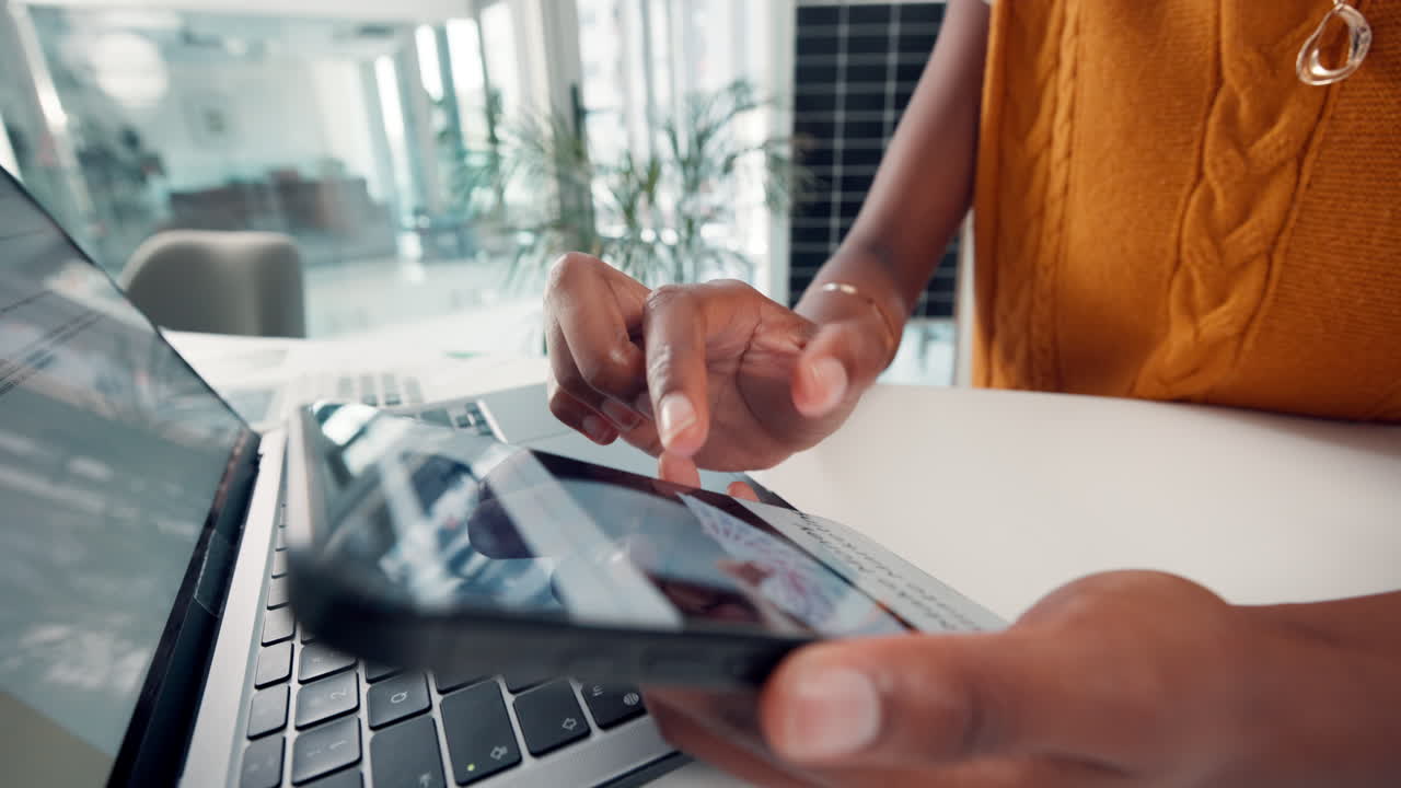 Close Up of Hands Scrolling on a Smartphone in an Office