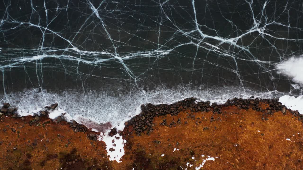 Frozen lake shoreline seen from above, Iceland