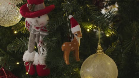 charming festive tree glows with snowman and deer