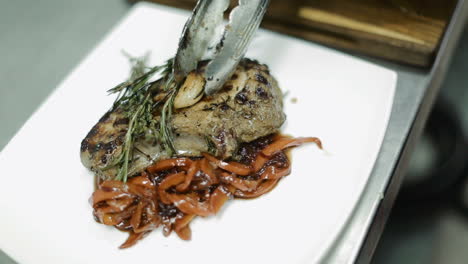 prepared meat steak with vegetables. chef preparing delicious meal in the restaurant kitchen