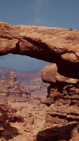 stunning red rock arch in desert canyon