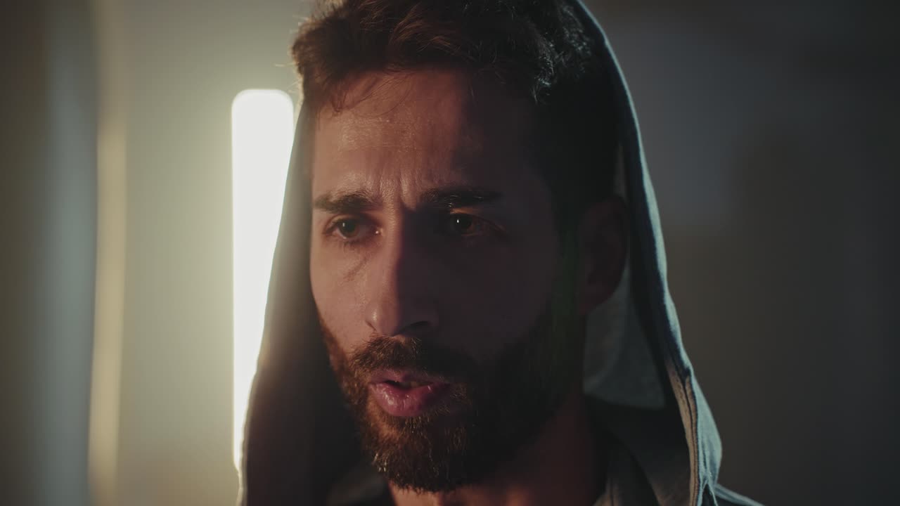 Close-up Portrait of a Man Wearing a Hoodie