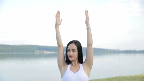 slim beautiful brunette during yoga classes against the background of the morning lake slim beautiful brunette during yoga classes against the background of the morning lake yoga in the fresh air