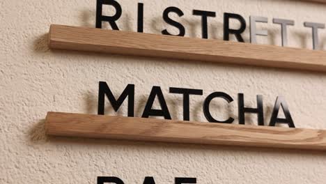 coffee shop menu board with wooden shelves