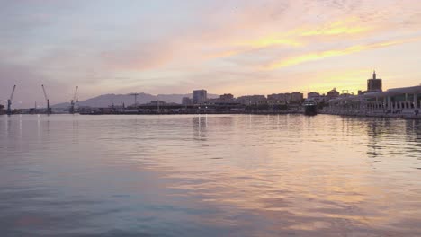 Vibrant-Colorful-Sunset-over-Water-in-Malaga-City,-Spain