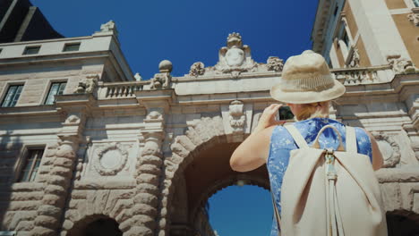 The-Tourist-Photographs-A-Famous-Arch-Near-The-Parliament-In-Stockholm-Tourism-In-Scandinavia-Concep