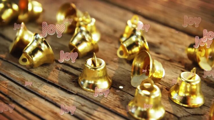Animation of joy text in repetition at christmas over bells