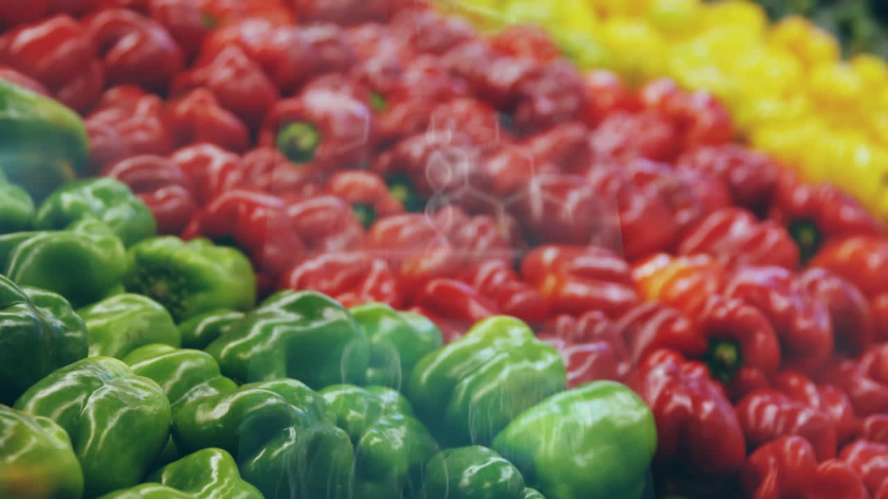 Vibrant bell peppers in green, red, yellow displayed at market, creating animation