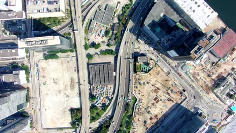 hong kong downtown kowloon urban area, top down aerial view with traffic and city skyscrapers