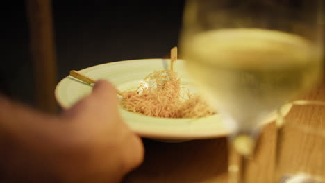 waiter serving the dish of the restaurant for dinner