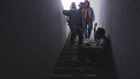 Young-man-using-smartphone-on-stairs