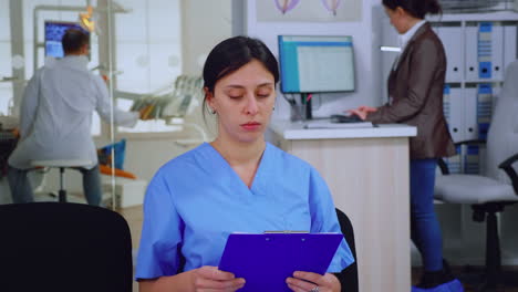 Portrait-of-smiling-nurse-looking-at-camera