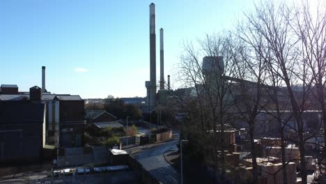 pilkington glass factory warehouse buildings aerial view descending town street