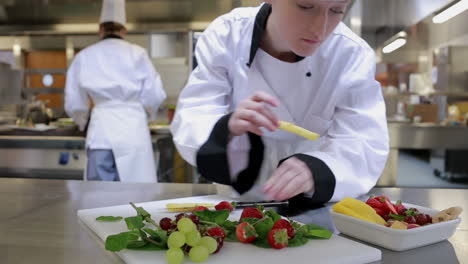 cook slicing fruit on the counter