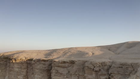 desert landscape with cliffs and hills