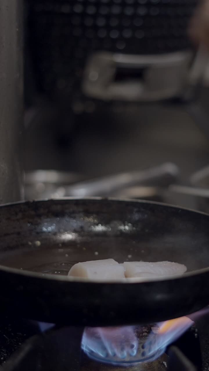 Pan-Frying Seafood in a Restaurant Kitchen