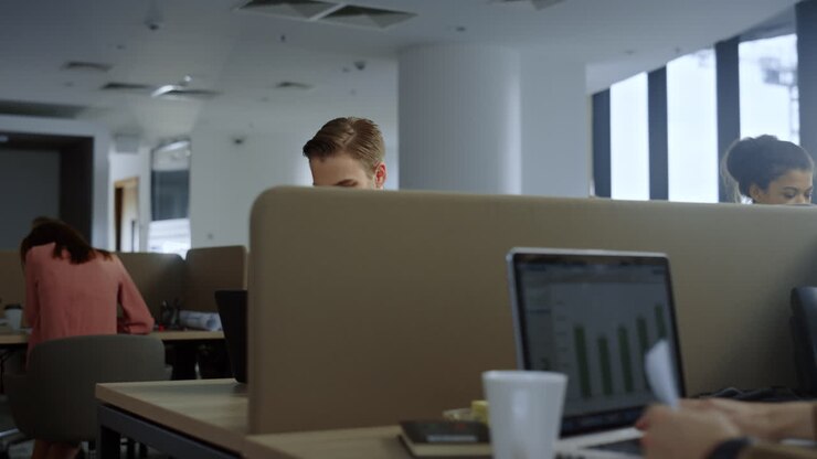 Businessman browsing internet on mobile phone. Employee typing on smartphone