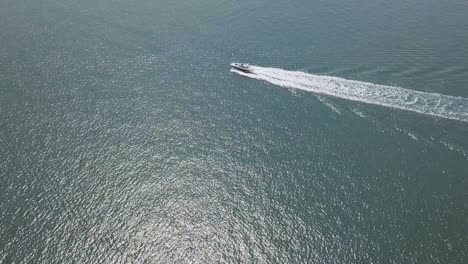 boat cruses across the frame. aerial shot