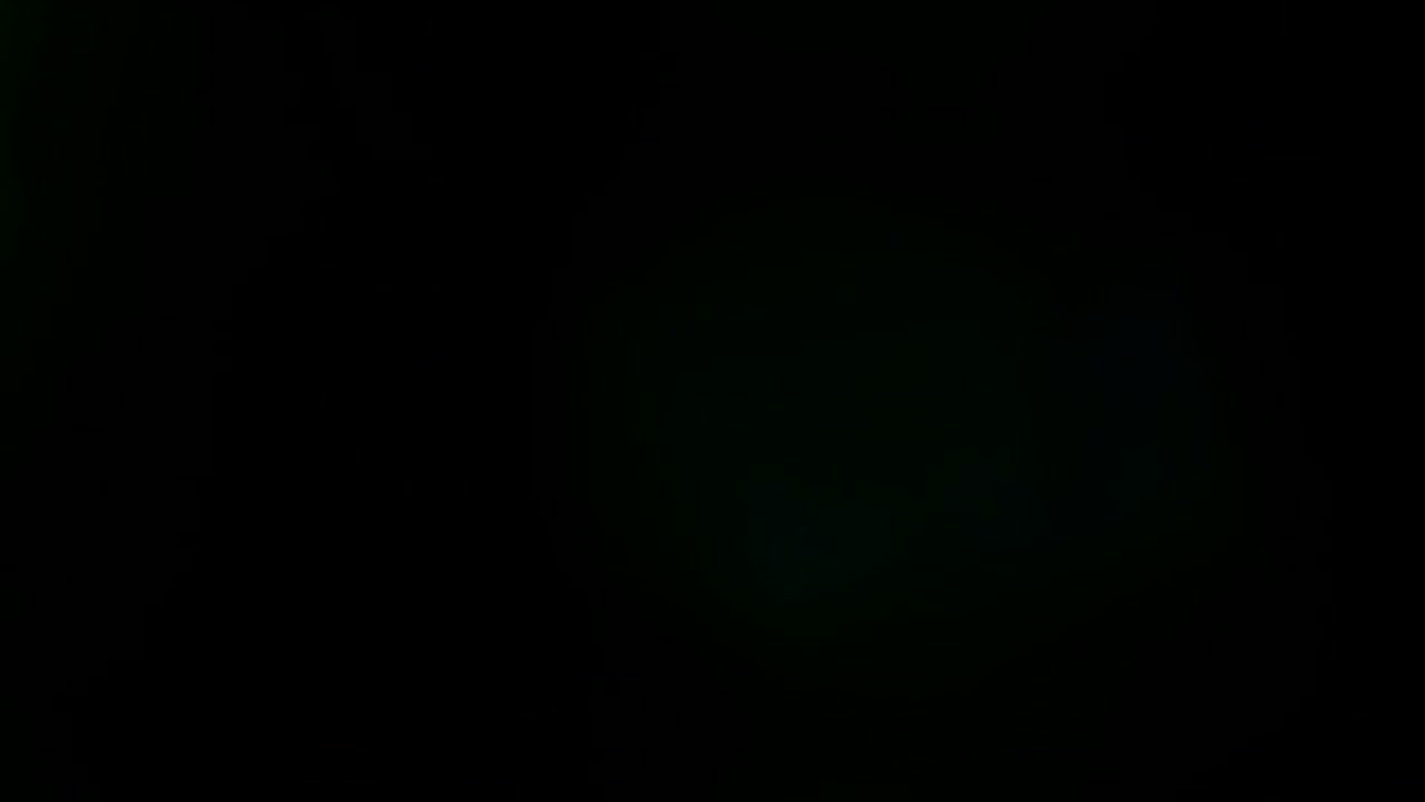 Abstract light leaks on black background.