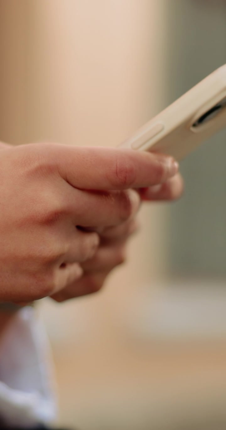 Close-up of Person Hands Using Smartphone