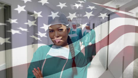 animation of flag of usa waving over surgeons in hospital