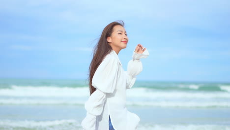 Young-girl-walking-along-the-beach-line