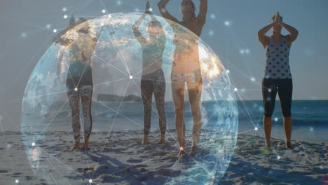 animation of glowing global network over female friends doing yoga on sunny beach