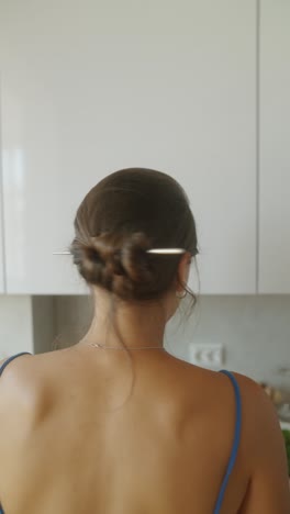 woman in a blue dress with updo