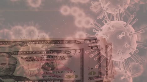 Animation-of-macro-Covid-19-cells-floating-over-a-person-putting-American-dollar-bills-on-a-table.-