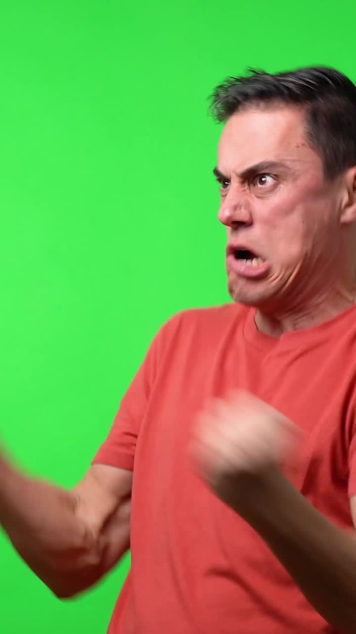 Man making various facial expressions on green screen