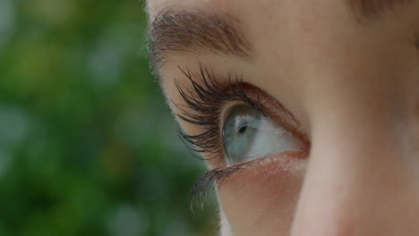 close up eye opening looking at nature outdoors seeing natural beauty macro iris healthy eyesight