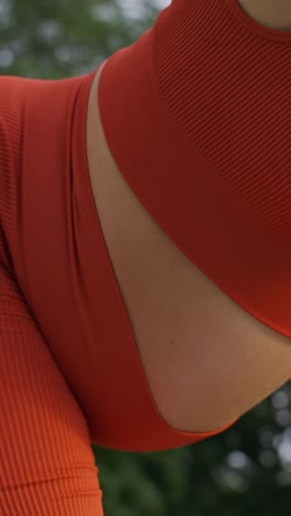 close-up of orange ribbed yoga set